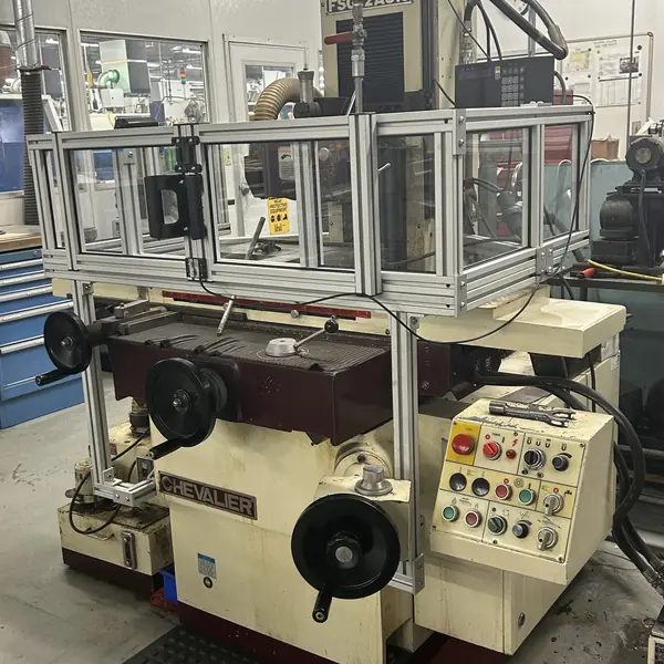 Chevalier surface grinder with an aluminum-frame guard enclosure