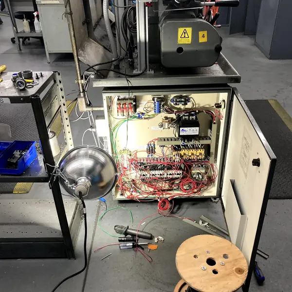 Open electrical control panel wired by 9EHS for a Hardinge machine