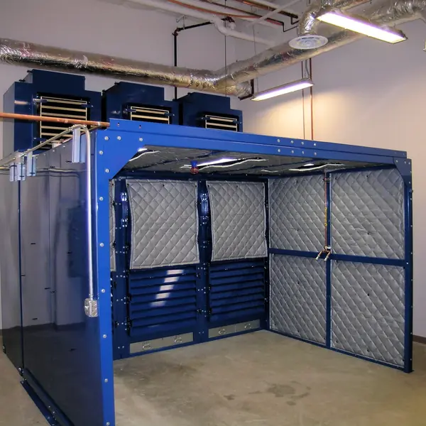 Blue-frame HEPA filtration enclosure with quilted acoustic panels