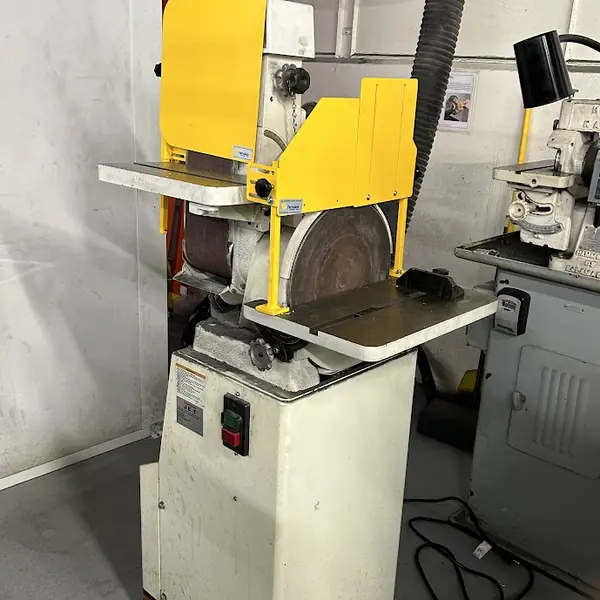 Jet belt and disc grinder with a yellow steel guard