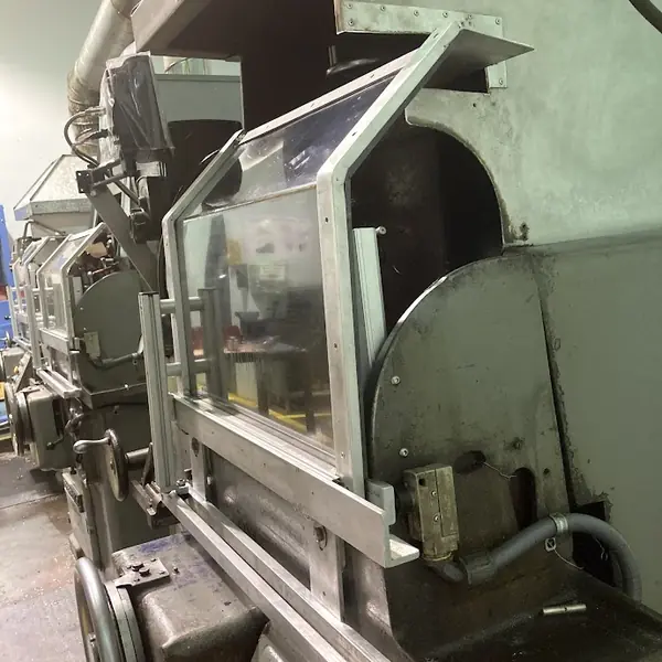 LCF grinder with a clear aluminum-frame guard over the wheel