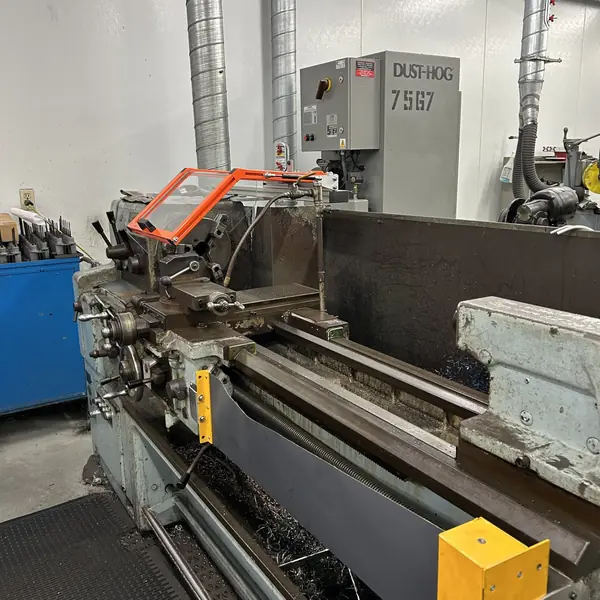 Mori Seiki lathe with an orange-frame chuck guard and yellow leadscrew cover