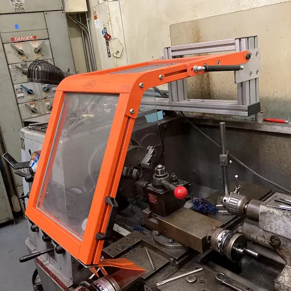 Victor lathe fitted with an orange-frame chuck shield